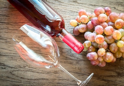 Rose wine with bunch of grape
